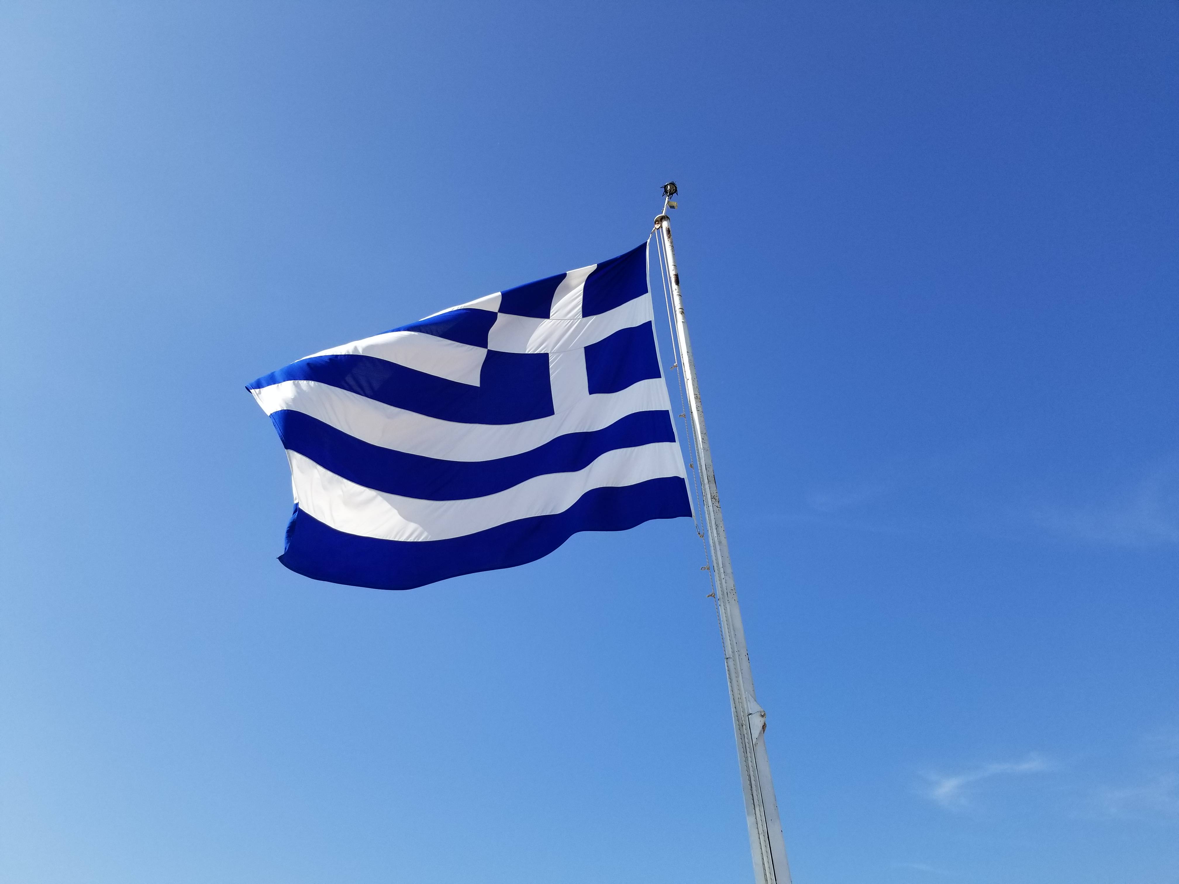Greek flag flying near the Acropolis